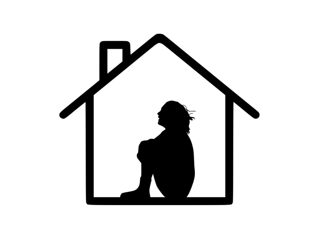 Silhouette of a person sitting with knees drawn up inside a house outline