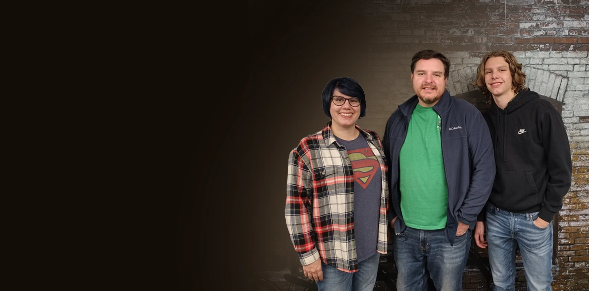Three players pose in front of an escape-room backdrop.